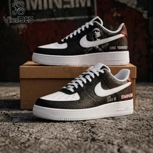 Custom Nike Air Force 1 sneakers featuring Eminem graphics, black cracked leather texture, white swooshes, and text motifs.!