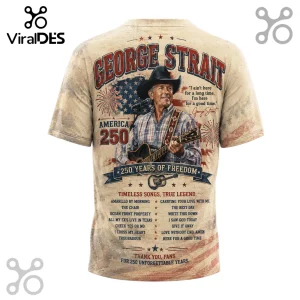 George Strait graphic t-shirt in beige with American flag background, guitar, list of song titles, and fireworks graphic.!