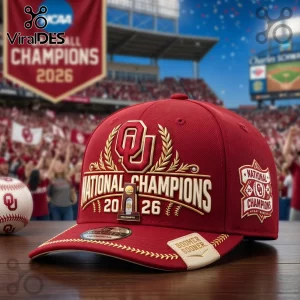 Oklahoma Sooners 2026 National Champions red baseball cap with gold embroidery and OU logo on a wooden surface.!