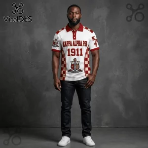 Kappa Alpha Psi polo shirt with 1911 text, red and white checkerboard side panels, and fraternity crest on grey background.!