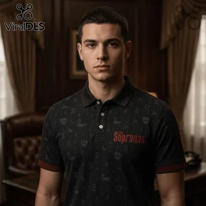 Man wearing a black short-sleeved polo shirt featuring The Sopranos logo and small patterns of ducks and playing cards.!
