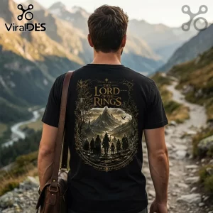 Black cotton t-shirt featuring The Lord of the Rings fellowship graphic print with gold mountains, figures, and text.!