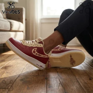 Maroon and cream leather sneakers featuring Delta Sigma Theta Greek embroidery, a hanging tassel, and translucent soles.!