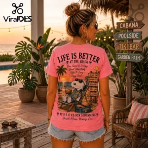 Pink t-shirt back graphic featuring Snoopy in sunglasses relaxing on a beach chair with palm trees at sunset.!