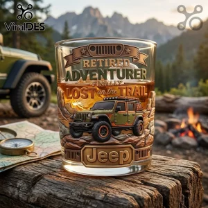 Whiskey glass with relief design featuring a green Jeep, mountain landscape, and text Retired Adventurer Lost on the Trail.!