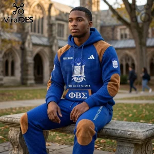 Man wearing royal blue quilted hoodie and joggers with Phi Beta Sigma crest, Greek letters, and brown suede elbow patches.!