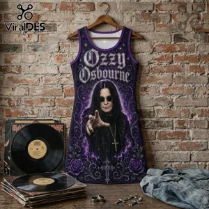 Ozzy Osbourne graphic tank dress featuring purple floral accents and star motifs hanging against a brick wall background.!