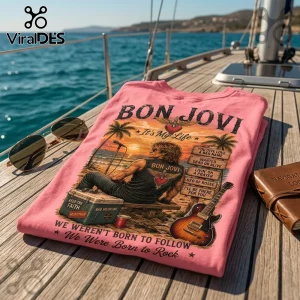 Pink t-shirt with Bon Jovi graphic art, a beach sunset illustration, song titles, and a guitar on a boat deck.!