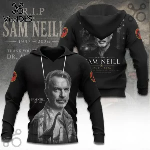 Black hoodie featuring a grayscale portrait of Sam Neill, Jurassic Park logos on sleeves, and text commemorating 1947-2026.!