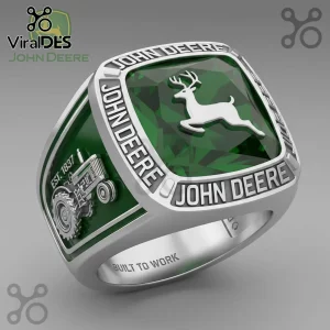 Silver John Deere commemorative ring with a green center stone, deer emblem, vintage tractor relief, and Built to Work text.!