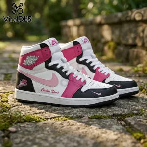 Custom Nike Air Jordan high-top sneakers in white, black, and hot pink with Thunderbirds logo on a stone path.!