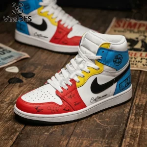 Simple Plan Bigger Than You Think Tour high-top sneakers with white, red, yellow, and blue leather panels on wood floor.
