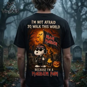Snoopy x Iron Maiden Halloween black t-shirt featuring Snoopy in a leather jacket holding a flag in a spooky cemetery.