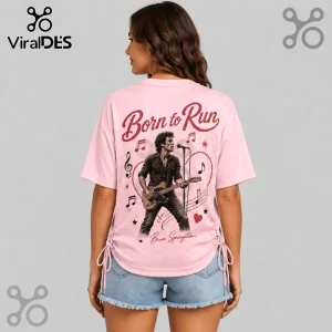 Bruce Springsteen Born to Run Pink Lace-Up Jersey featuring a graphic of the singer playing guitar on a light pink top.