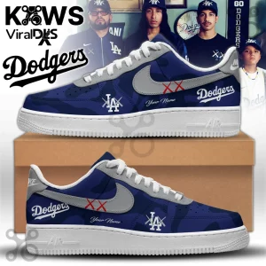 Los Angeles Dodgers x Kaws Air Force 1 sneakers in blue and white with custom lettering on a cardboard shoebox.
