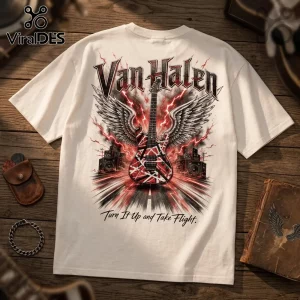 Off-white cotton t-shirt featuring a Van Halen graphic with a striped guitar, wings, speakers, and red lightning bolts.!