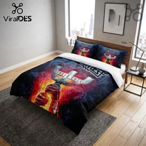 Judas Priest Single Cuts bedding set featuring a metallic trident, burning fire graphics, and blue smoke on a bedroom bed.!