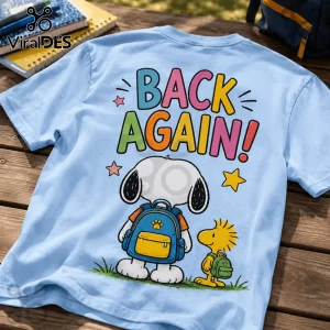 Light blue t-shirt with a back print of Snoopy and Woodstock wearing backpacks above the text BACK AGAIN! in colors.!