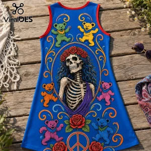 Blue sleeveless dress with Grateful Dead dancing bears, skull with rose crown, and peace sign on a wooden surface.!