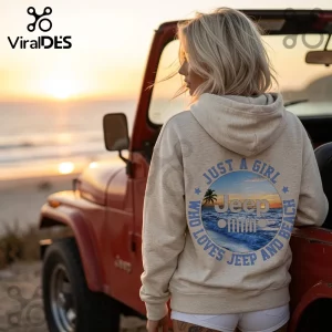 Woman wearing a beige hoodie with a round beach graphic, blue text reading Just A Girl Who Loves Jeep And Beach.!