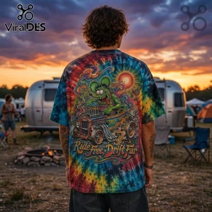 Tie-dye t-shirt featuring a green rat driving a hot rod with the text Ride Free, Drift Far at a sunset campground.!