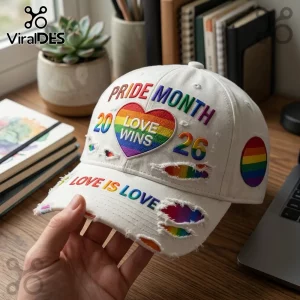 White distressed baseball cap with Pride Month 2026, Love Wins, and Love is Love embroidery, featuring rainbow accents.!