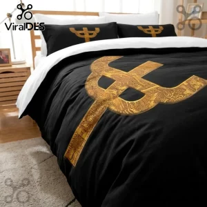 Black and white duvet cover set featuring a large gold ornate trident graphic print on a bedroom bed.!