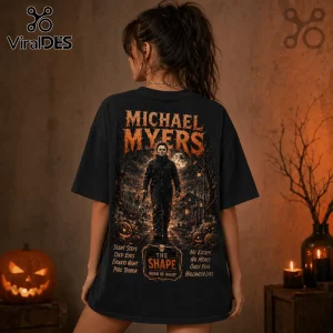 Black cotton t-shirt featuring a Michael Myers graphic with horror text, pumpkin motifs, and a spooky night landscape.!