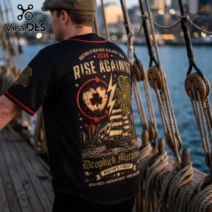 Back view of a black baseball jersey with Rise Against and Dropkick Murphys Australia New Zealand Tour 2026 band graphics.!