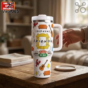 White stainless steel tumbler with handle featuring Friends TV show icons like the yellow frame and Central Perk logo.!