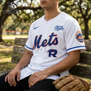 White New York Mets baseball jersey featuring Fuerza Regida embroidery, blue Nike logo, and Mets sleeve patch on a man.!