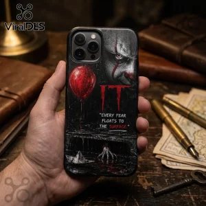 iPhone case featuring Pennywise from IT, red balloon, paper boat, and the quote Every fear floats to the surface.!