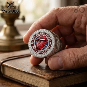 Silver Rolling Stones 65th anniversary ring with central ruby-colored lips logo and circular crystal trim.!