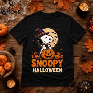 Snoopy Fall-O-Ween Jesus Two-Sided Black T-Shirt featuring Snoopy in a witch hat sitting on a pumpkin under a full moon.