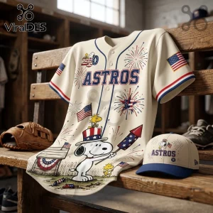 Cream baseball jersey and matching cap featuring Snoopy, Woodstock, Astros text, fireworks, and American flag graphics.!