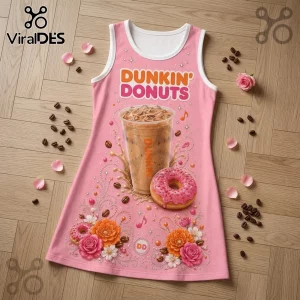 Pink Dunkin Donuts sleeveless dress featuring iced coffee and strawberry frosted donut graphics on light wood background.!