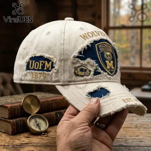 Distressed cream-colored Michigan Wolverines baseball cap with blue patches, gold embroidery, and 1879 date text.!