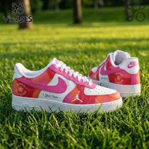 WNBA All-Star 2026 Pink Nike Air Force 1 sneakers with custom branding and white soles sitting on green grass.