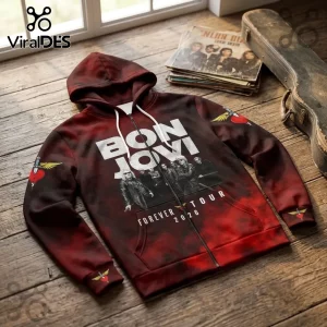 Bon Jovi Forever Tour 2026 zip-up hoodie featuring red tie-dye pattern, band graphic, and heart-dagger sleeve logos.!