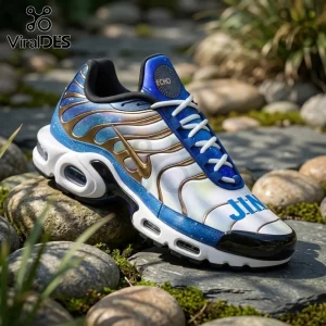 Jin BTS Galaxy Blue Air Max Plus sneakers with cosmic blue patterns, gold cage overlays, and white soles on river stones.