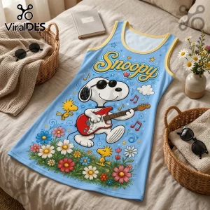 Light blue Snoopy tank top featuring the character playing a red electric guitar amidst colorful flowers and Woodstock.!