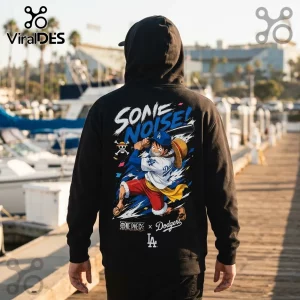 Black hoodie featuring Monkey D. Luffy in a Dodgers jersey holding a bat with One Piece x Dodgers text graphic on back.!
