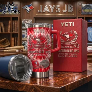 Toronto Blue Jays 50th anniversary red tie-dye YETI tumbler with matching gift box on a wooden desk.!