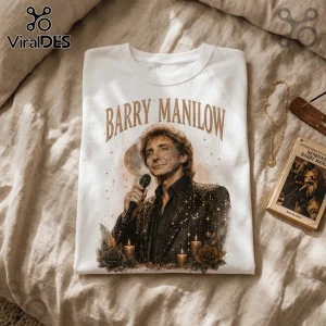 White cotton t-shirt featuring a vintage style graphic of singer Barry Manilow with gold text, stars, and roses.!