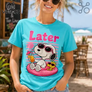 Bright turquoise T-shirt featuring Snoopy and Woodstock on a pink pool float with the word Later printed in pink text.!