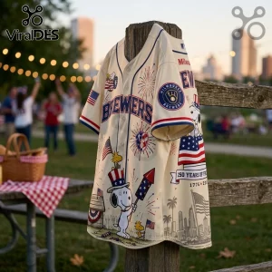 Cream Milwaukee Brewers baseball jersey with Snoopy, patriotic graphics, fireworks, and text reading 250 Years of Freedom.!