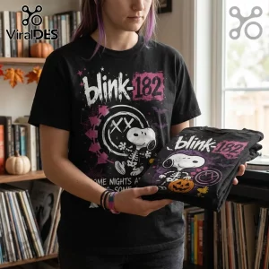 Blink-182 x Snoopy Skeleton Halloween black t-shirt featuring a skeletal Snoopy, pumpkin, and band logo graphics.