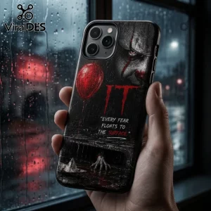 Black iPhone case featuring Pennywise from IT with a red balloon, text Every fear floats to the surface, and sewer grate.!