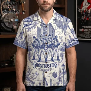 Ghostbusters Toile De Jouy blue button down shirt featuring a repeat print of the movie characters and New York landmarks.