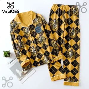 Hufflepuff Harry Potter pajama set in yellow and black diamond pattern with house crests on a white surface.!